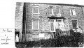 View of front of Wrose View. Bedroom is above the LH door.